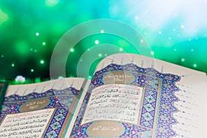 Opening pages of holy book Qur`an with green background
