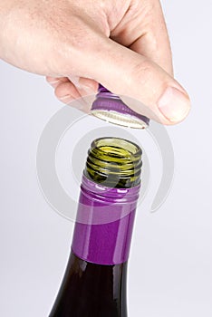 Opening a Screwcap on a Bottle of Red Wine