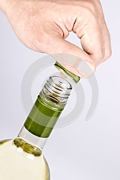 Opening a Screwcap on a Bottle of White Wine