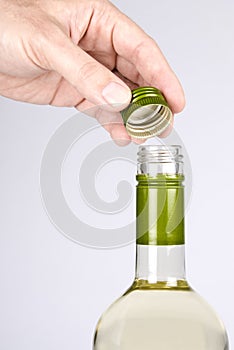 Opening a Screwcap on a Bottle of White Wine