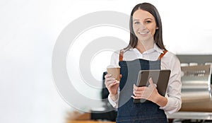 Opening a small business, AHappy Asian woman in an apron standing near a bar counter coffee shop, Small business owner