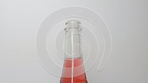 Opening sparkling wine bottle with plastic cork