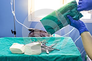 Opening of surgical sterile material before a surgery