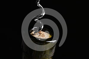 Opening wine bottle with corkscrew, closeup. Space for text