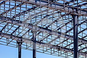 Openwork metal roof frame supported by metal columns