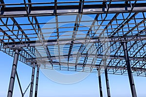 Openwork metal roof frame supported by metal columns