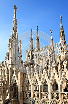 Openwork pinnacles at Milan Cathedral in Italy photo