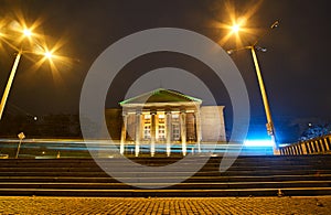 Opera building and traffic light at night