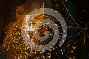 Operater tapping molten metal