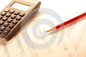 Operating budget, calculator and pencil