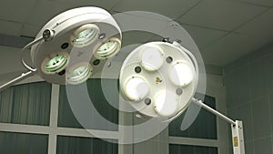 Operating emergency room surgery theater lighting in hospital to enable surgeon to see well in operations.