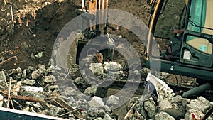 Operating excavator and debris