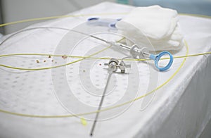 In the operating room, there is an instrument for cystoscopy and stones from the bladder and urethra on the table. The