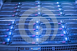 Operating servers installed in the server room of the data center. Storage servers are in the rack. Blue display on the front of