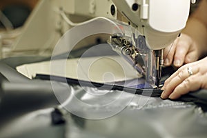 Operating Sewing Machine Creating Detailed Needlework