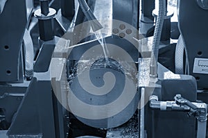 The operation of band saw cutting machine cutting the metal shaft parts with coolant method