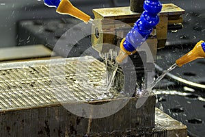 The operation of EDM machine working with graphite electrode