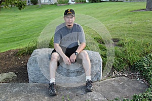 Operation Iraqi Freedom Veteran sitting on a rock