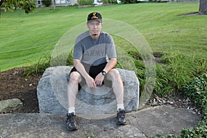 Operation Iraqi Freedom Veteran sitting on a rock photo