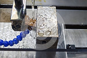 The operation of side spark EDM machine with copper electrode