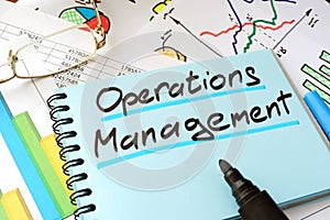 Operations Management written on a notepad.