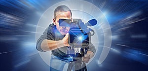 Operator with a camera on an abstract technological background. Digital video technologies