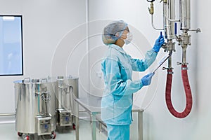 The operator checks the equipment for the production of sterile