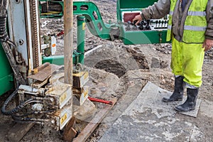 Operator on controls of core drilling machine