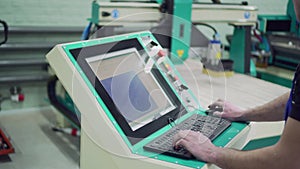 The operator controls the operation of the CNC machine.