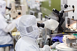 Operator in factory use microscope