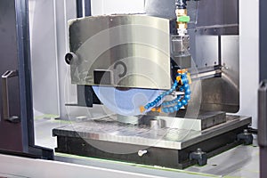 Operator grinding surface of mold and die parts