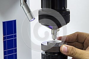 Operator inspection hardness by rockwell hardness tester photo