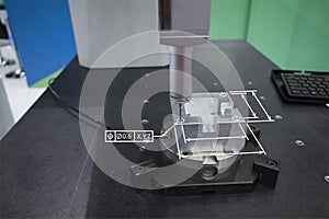 Operator inspection high precision part by CMM coordinate measuring machine