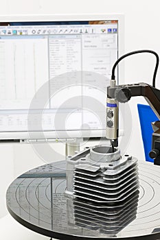 operator inspection roundness of body cylinder in machining process by roundness tester