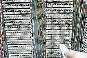 Operator installing telephone switchboard