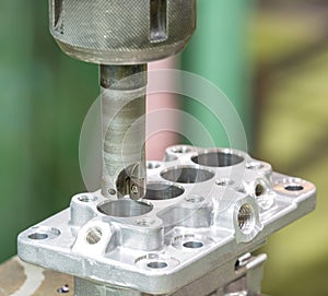 Operator machining automotive parts by machining center