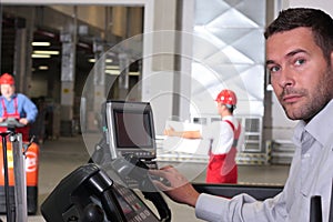 Operator pressing keys at control panel