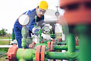 Operator recording operation of oil and gas process at oil and rig plant