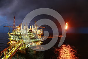 Operator recording operation of oil and gas process at oil and rig plant, offshore oil and gas industry, offshore oil and rig