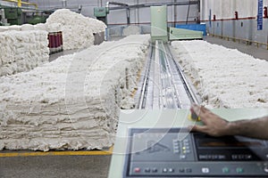 Operator's hand at the control pannel