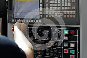Operator sets up the work of the CNC machine