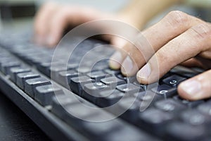 Operator typing on dirty keyboard