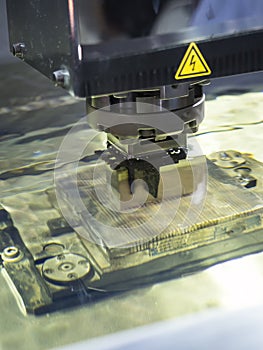 Operator use EDM electrod to make precision mold and die