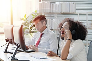 Operator woman agent with headsets working in a call centre