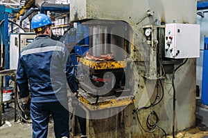 Operator working with hydraulic press