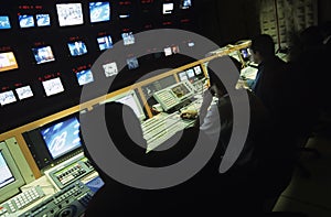 Operators In Central Control Room At Television Station