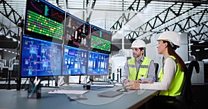 Operators and engineers monitor SCADA system using control in factory