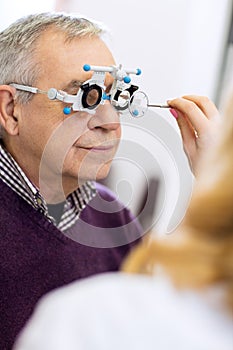 Ophthalmic doctor measure distance of eyes pupil photo