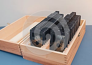 Ophthalmic lenses in a wooden box. Selection of glasses, vision treatment
