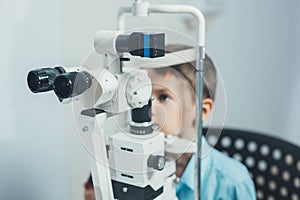 Ophthalmologist checks the boy`s vision. Hyperopia. Vision tests in children